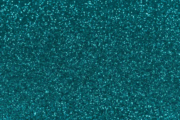 Blue sparkling glitter background, christmas abstract shiny texture. Holiday lights