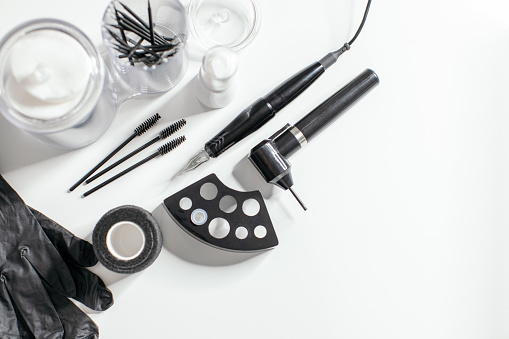 Some of the tools needed for microblading technique for permanent make up treatment. Photo taken over white background
