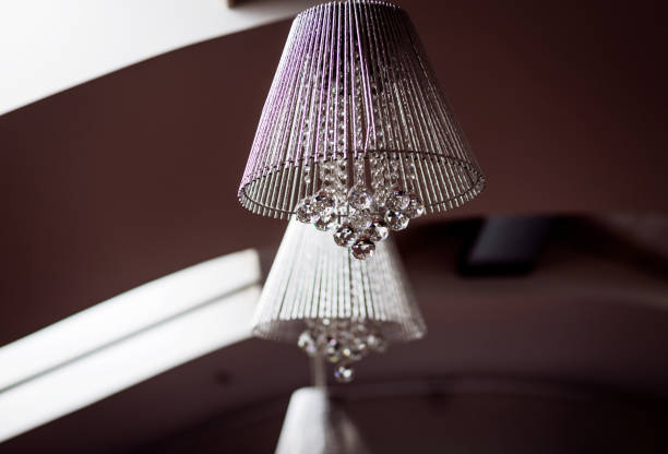 Luxurious crystal chandelier in a house. Royal lamp