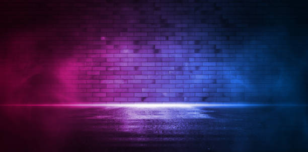 istock Rays neon light on neon brick wall. Empty scene. Neon reflections on wet asphalt 1347226246
