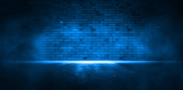 istock Empty dark scene. Blue brick stone background with smoke.Light reflections on wet asphalt. 1347226249