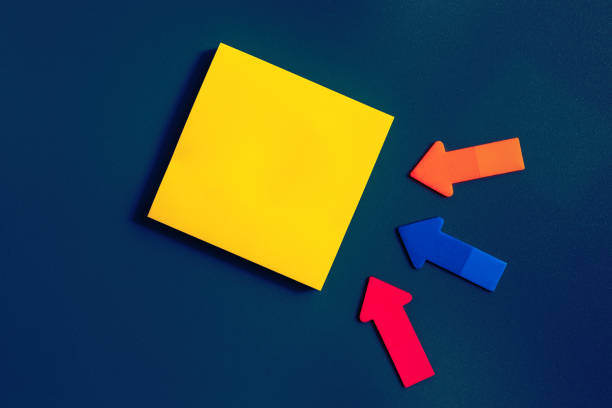 istock Yellow Square Blank note and three small arrows on a blue background. Short Note. Paper stick note 1347226295