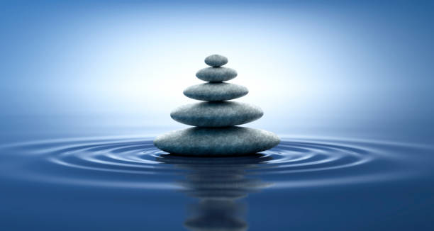 istock Stack of stones in water ripples and  reflections 1347227375