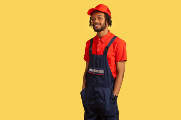 istock Handyman looking at camera, being proud of done work, keeps hands in pockets, service industry. 1347228747