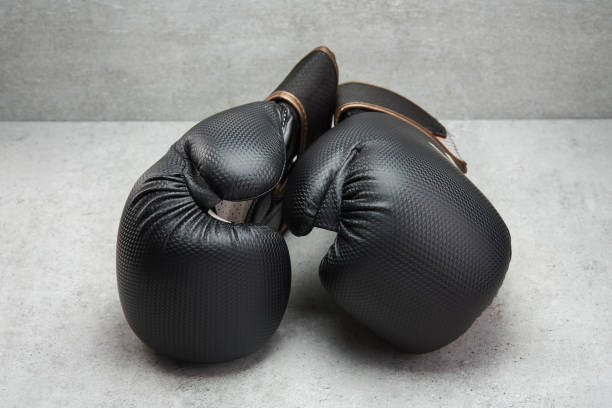 istock Pair of boxing gloves on concrete background 1347229624