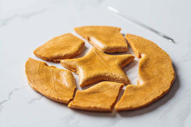 istock Dalgona Candy - South Korean treat. Round sugar cookie with star inside. 1347230567