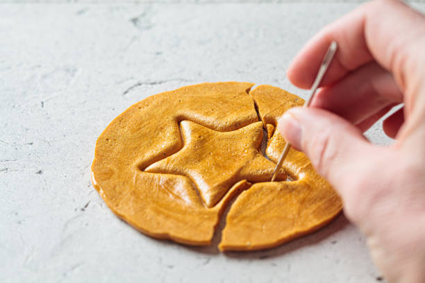 istock Dalgona Candy - South Korean treat. Round sugar cookie with star inside. 1347230707