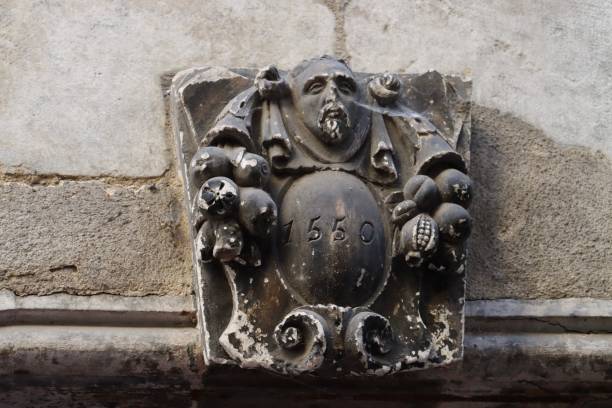 istock Old Sculpture above a door 1347233600