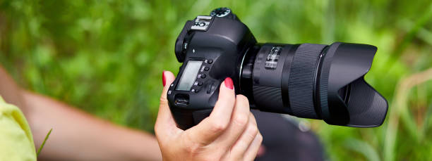 istock Photographer woman pack or takes out her camera backpack 1347235184