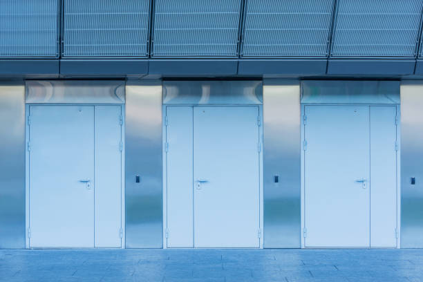 istock Three closed doors of the new building. 1347236297