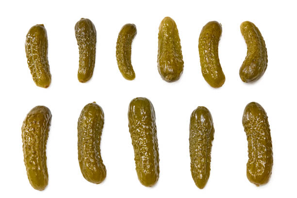 istock marinated pickled cucumbers isolated on white background. Clipping path and full depth of field. Top view 1347236487