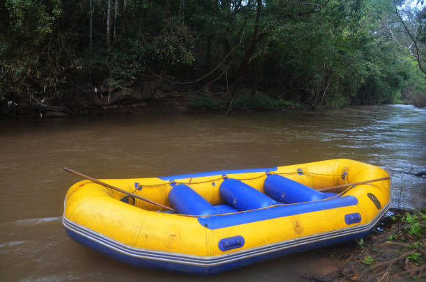 istock White water rafting rubber boat with movement water fast 1347237855
