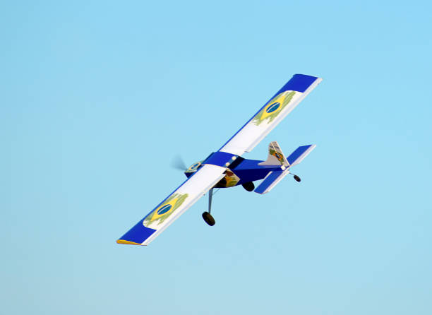 istock white and blue model airplane in flight 1347238150