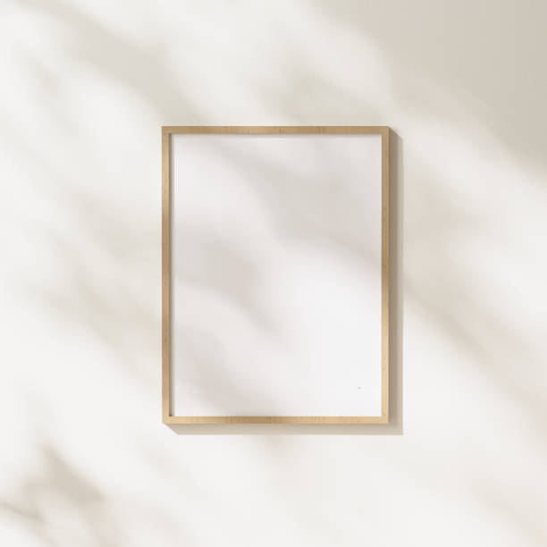 istock blank wooden frame mock up with leaves shadows and sunlight on white wall background, 3d rendering 1347238382
