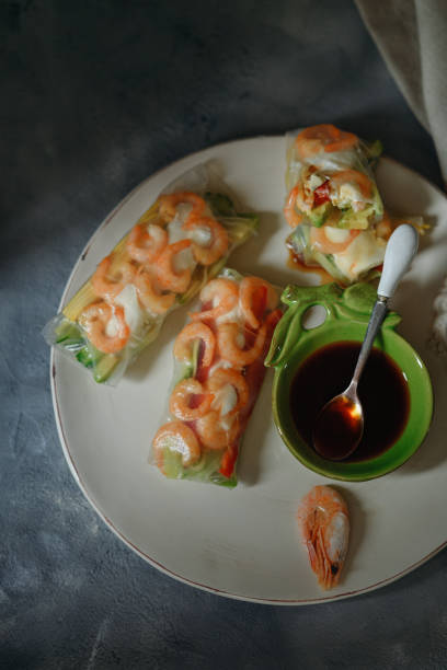 istock Japanese sushi, fresh roll with shrimp in rice paper 1347239373