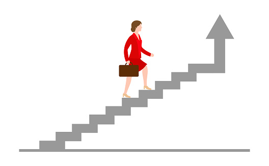 Businesswoman rising up the stairs of the career. Growing career concept