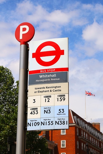 Bus stop sign at Whitehall Horseguards Avenue in London, UK. There are 19,000 bus stops in London.