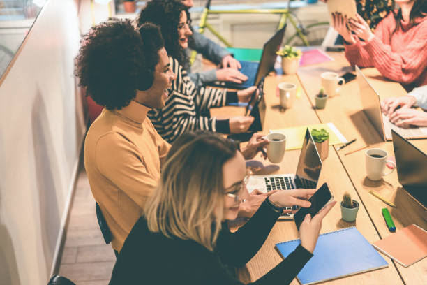 istock Young business people working inside modern coworking office - Soft focus on african man face 1347244417
