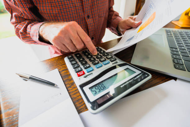 istock Senior man checking bills at home 1347245586
