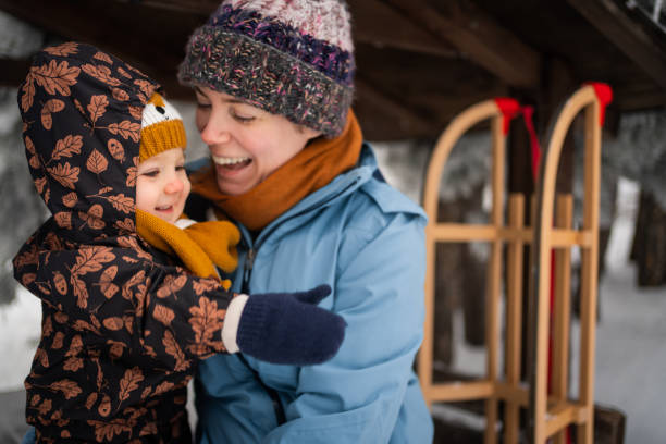 istock Smiling mother, and her son bonding during winter adventure 1347245876