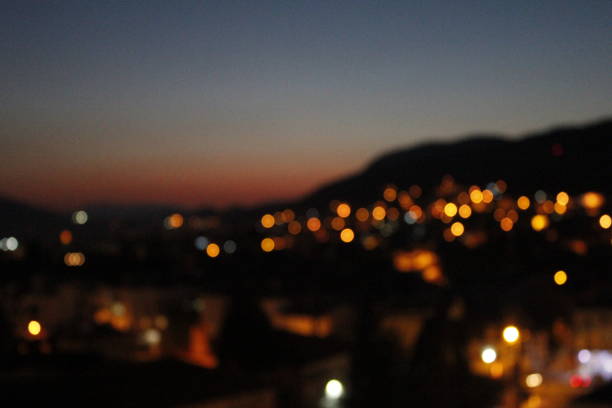Beautiful color scheme of the sky behind the city lights