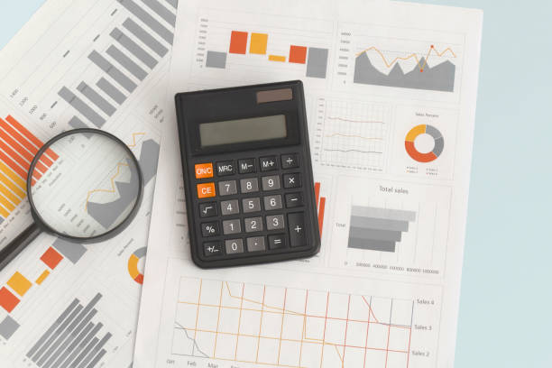 istock Business graphs, charts, magnifying glass and calculator on table. Financial development, Banking Account, Statistics 1347248066