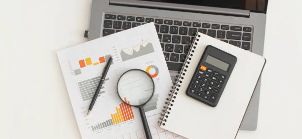 istock Business graphs, charts, laptop, magnifying glass and calculator on table. Financial development, Banking Account, Statistics 1347248067