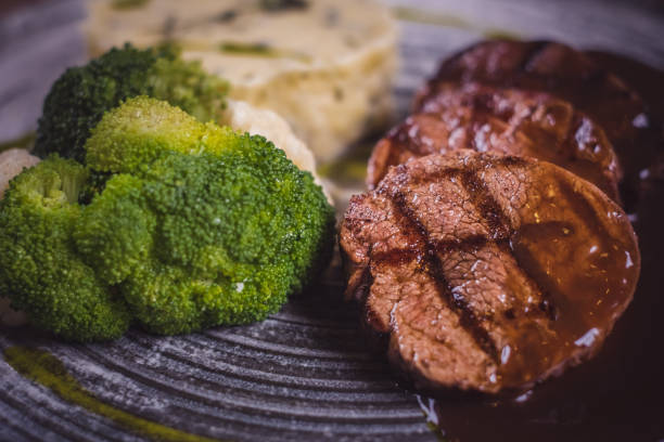Grilled steak, mashed potatoes and vegetables