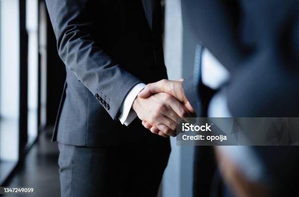 Business People Shaking Hands Finishing Up A Meeting Stock Photo - Download Image Now