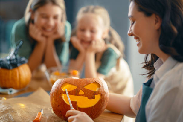 istock family preparing for Halloween. 1347249386
