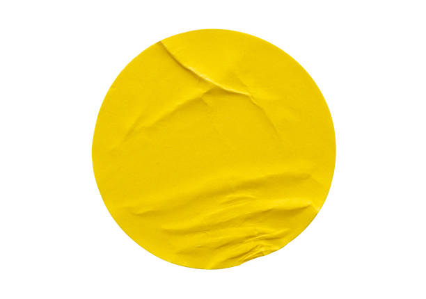 istock Yellow round paper sticker label isolated on white background 1347250838