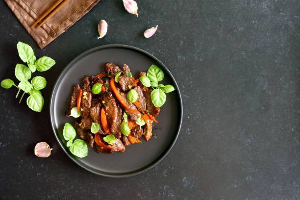 istock Thai beef stir-fry with pepper and basil 1347251048