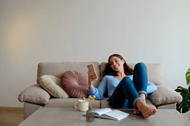 istock Young woman on the couch 1347251710