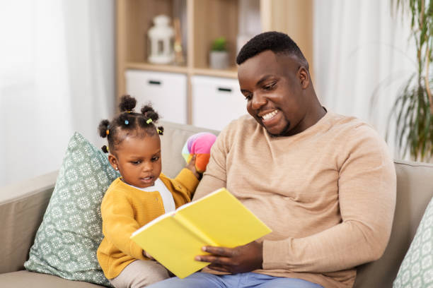 istock african father reading book for baby daughter 1347251725