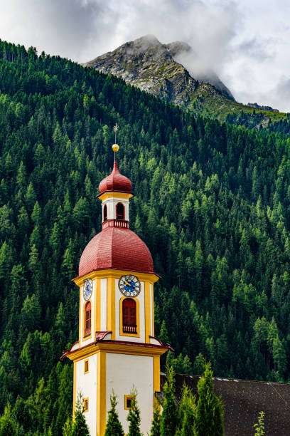 A peak of mountain Habicht in austrian Stubai Alps with the local church in foreground. A peak of mountain Habicht in austrian Stubai Alps with the local church in foreground. neustift im stubaital stock pictures, royalty-free photos & images