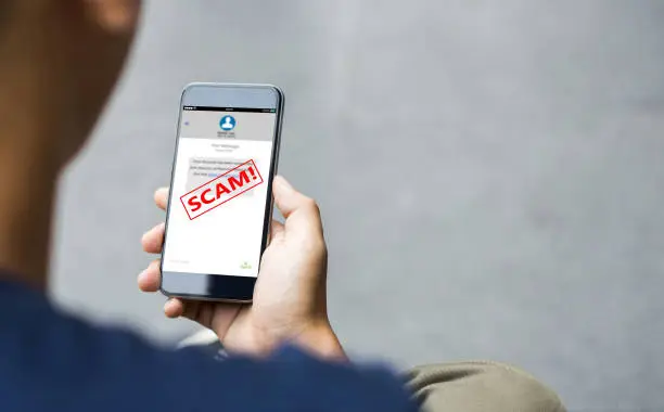 Photo of Text message SMS scam or phishing concept