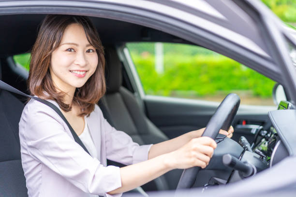 istock Young woman driving a car 1347255588