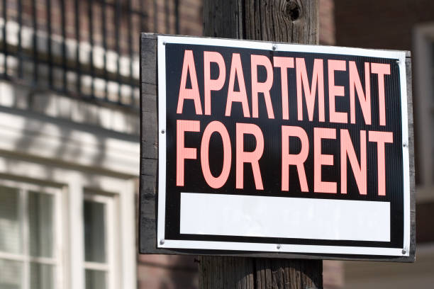 apartment for rent close-up of a rental sign in front an apartment building flat stock pictures, royalty-free photos & images