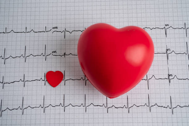 istock Red heart on electrocardiogram ECG graph, heart wave, heart attack, cardiogram report. 1347257955