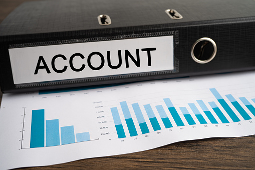 Account, Accounting. Binder data finance report business with graph analysis in office.