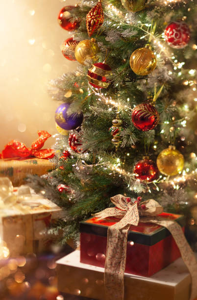 istock Christmas tree with ornaments and festive gift boxes. 1347258332