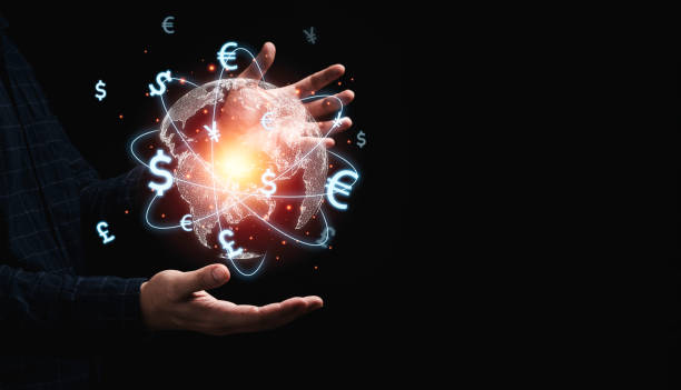 istock Global currency exchange concept, Trader holding world with virtual line effect and dollar yuan yen euro and pound sterling sign. 1347260512