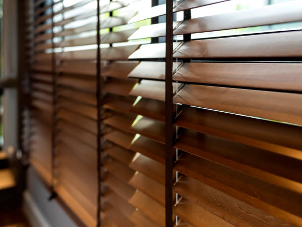 wooden window shutter blind with light from sun home interior concept wooden window shutter blind with light from sun home interior concept window blinds photos stock pictures, royalty-free photos & images