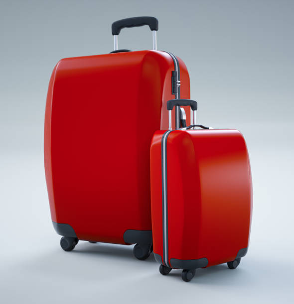 Two red travel bags isolated on bright white background.