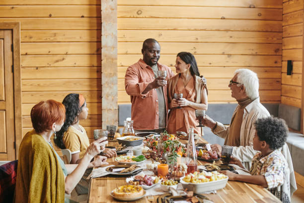 istock Family gathering at dining table 1347262712