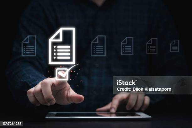 Businessman Using Tablet And Touching On Document Icon For Approve And Online Document Concept Stock Photo - Download Image Now