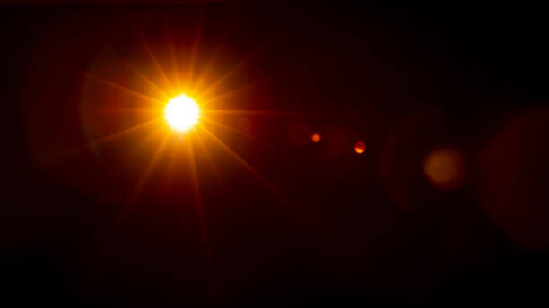 istock Sun flare on the black background 1347264511