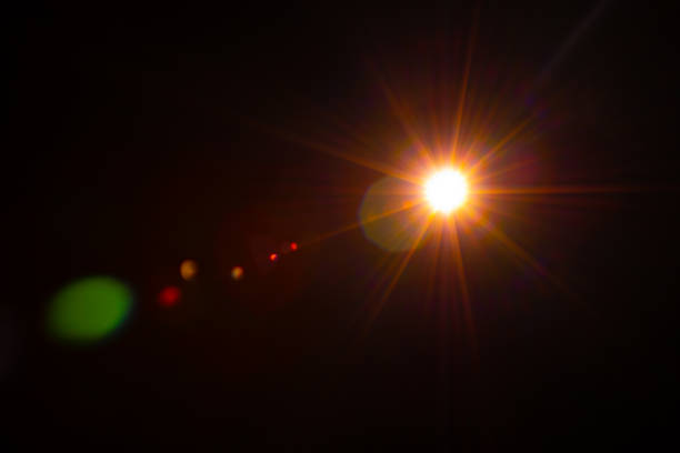 istock Sun flare on the black background 1347264514