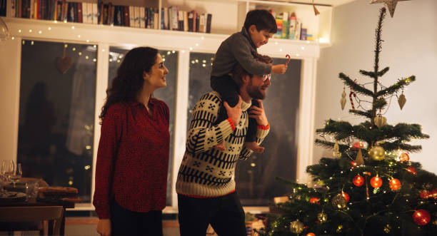 istock Family celebrating Christmas at home 1347264814