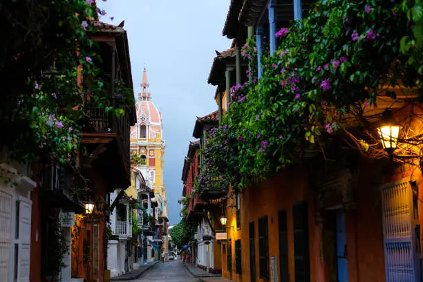 This street reveal the Cathedral Tower in Cartagena, shot in the evening.